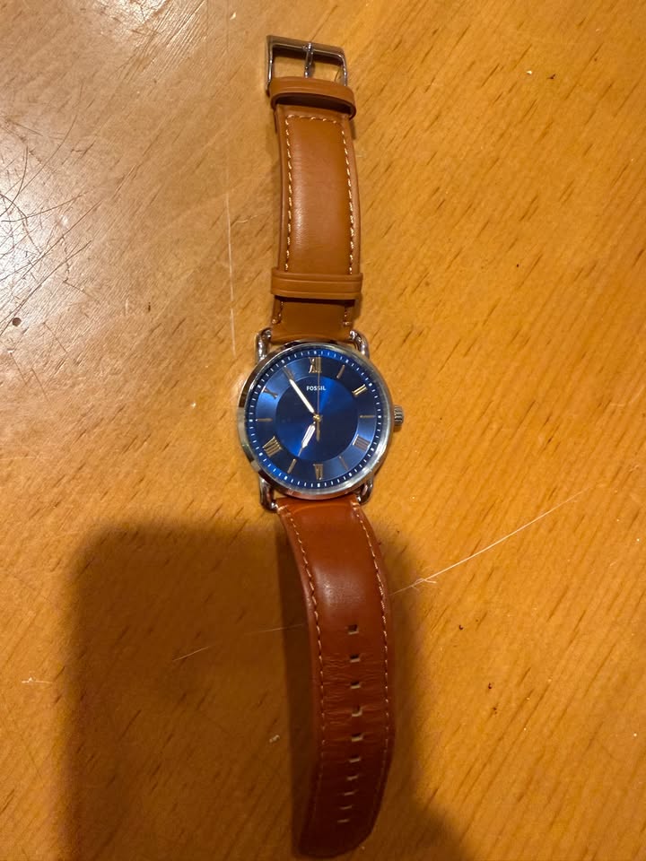 Fossil watch with blue dial and brown leather strap