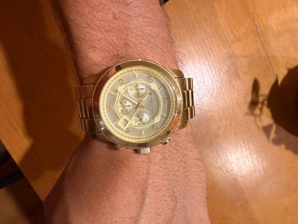 Gold-tone Michael Kors chronograph on wrist
